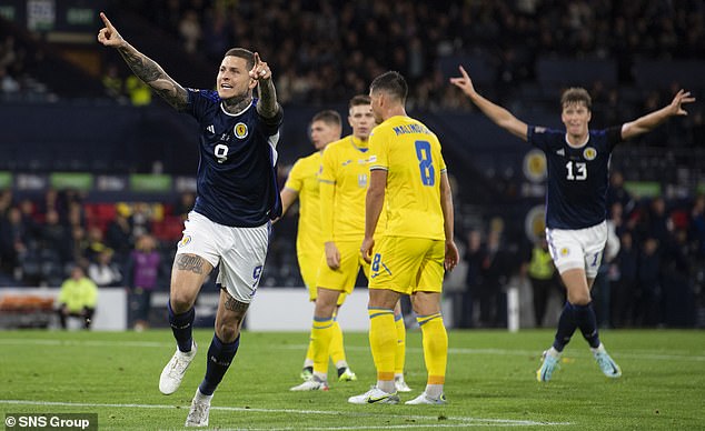 Lyndon Dykes enjoys a goal against Ukraine in the previous Nations League campaign