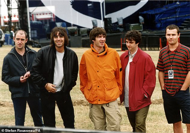 Pictured, Oasis at Knebworth in 1996. Many Oasis fans are hoping this is the line-up that will appear next year, with Paul McGuigan (second right) on bass and Alan White (far right) on drums. Paul 'Bonehead' Arthurs (far left) has already been confirmed to join the brothers, according to reports