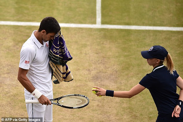 A ball girl with Djokovic, who once apologized for his anger towards another ball girl at Wimbledon