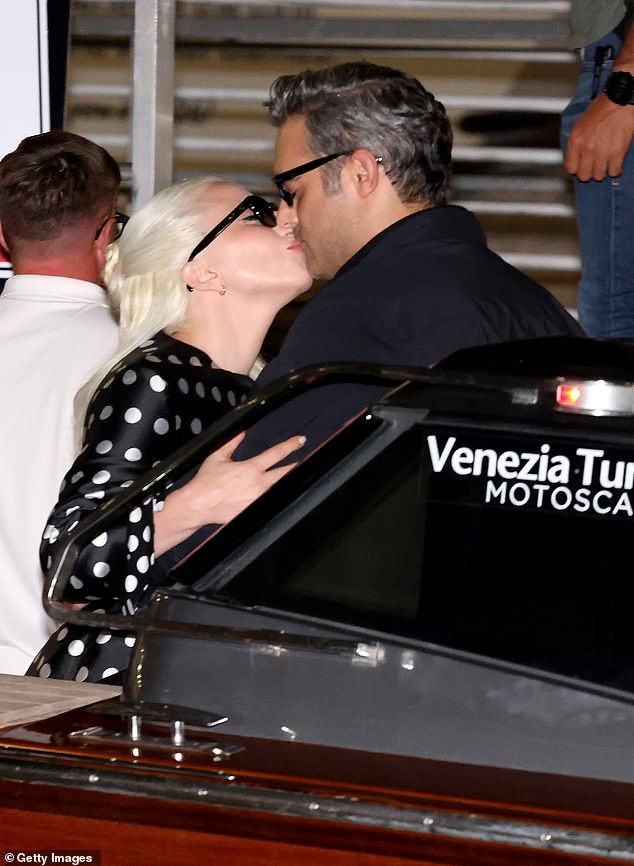 The future husband and wife shared a kiss and cozyed up as they boarded a water boat