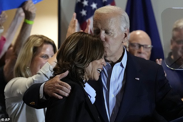 President Joe Biden kisses Kamala Harris on the forehead