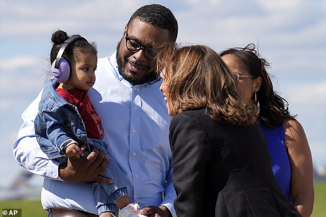 Vice President Kamala Harris greets Pennsylvania Lt. Gov. Austin Davis and his daughter Harper upon arrival in Pittsburgh