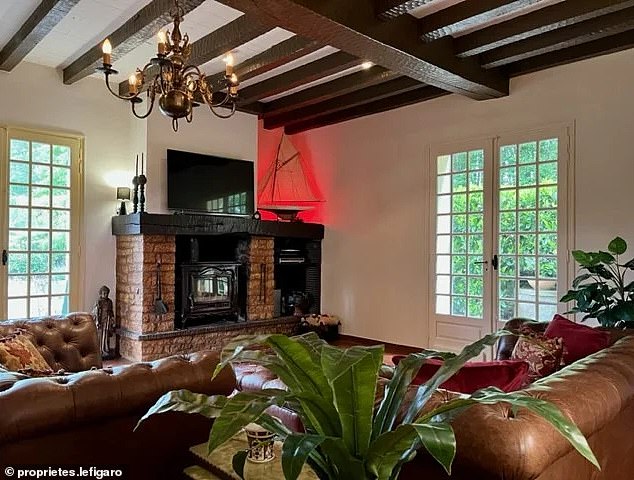 The house is filled with 19th century style furniture, Chesterfield sofas and a fireplace