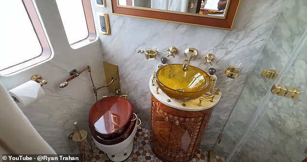 To top it all off, there's a marble-clad bathroom with a shower, frosted glass window for privacy, glass sink and old-fashioned toilet.