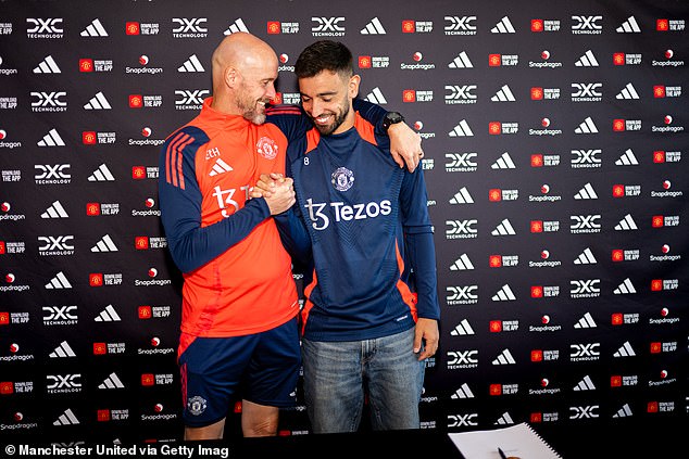 Fernandes pictured with Erik ten Hag earlier this month after the player signed a new contract