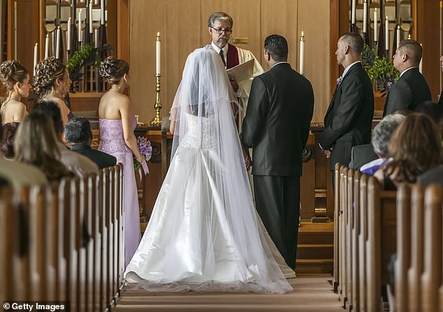 The bride discovered her mother was dragging her feet getting ready at the hotel and that was the reason she arrived 45 minutes late (stock photo)