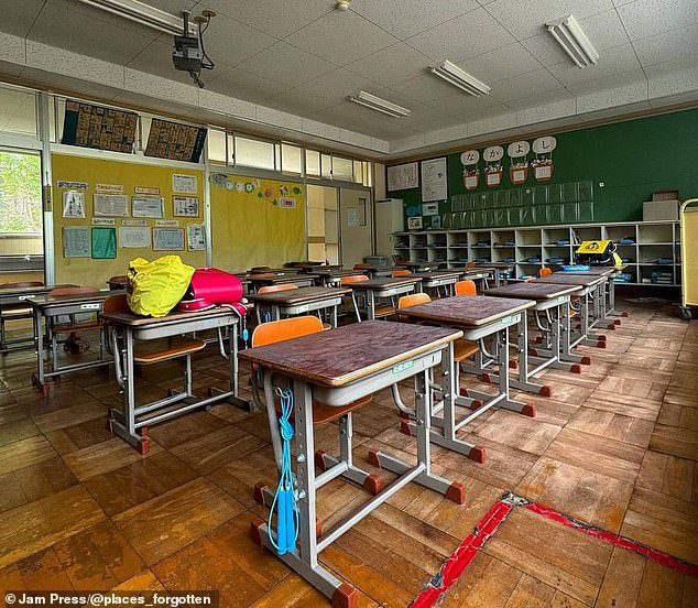 The school still had homework hanging on the walls and bags on the tables