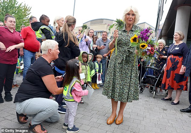 Flowers for the lady! Camilla received a bouquet of flowers from a young benefactor