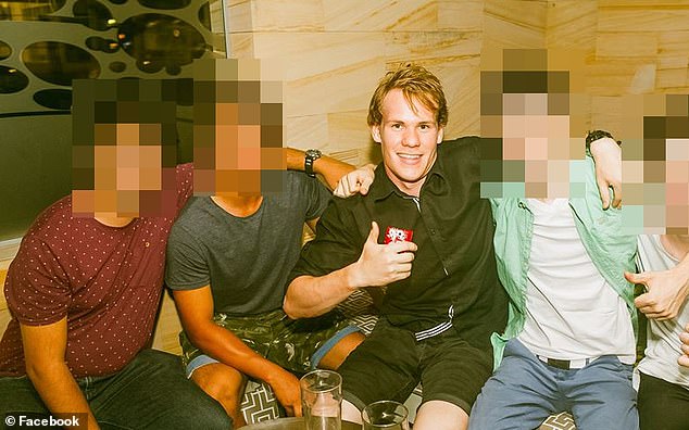 Davies (pictured centre) claims he was suffering from psychosis at the time of the incident and didn't know what he was doing