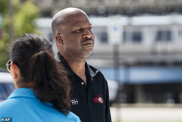 Forest Park Mayor Rory Hoskins stands outside the Forest Park Blue Line train station in Forest Park, Illinois, which remains closed, after giving a press conference about four people who were fatally shot on the train Monday morning, September 2, 2024.