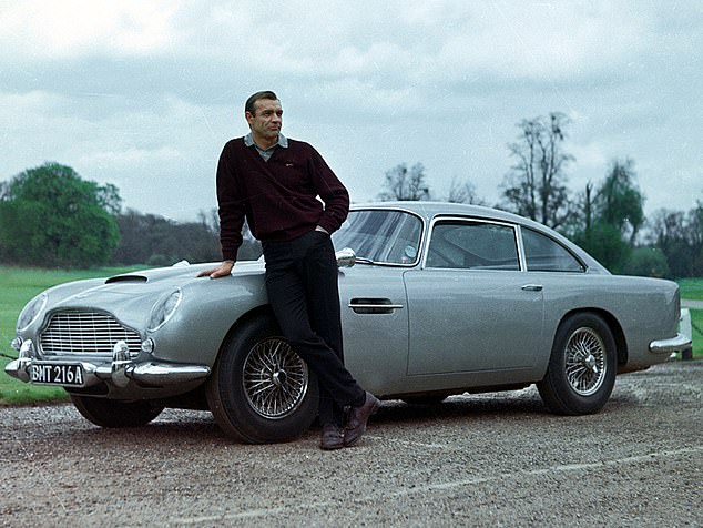 The Aston Martin was once described as 'the most famous car in the world' thanks to its association with James Bond. Sean Connery first drove it in 1964's Goldfinger (pictured).