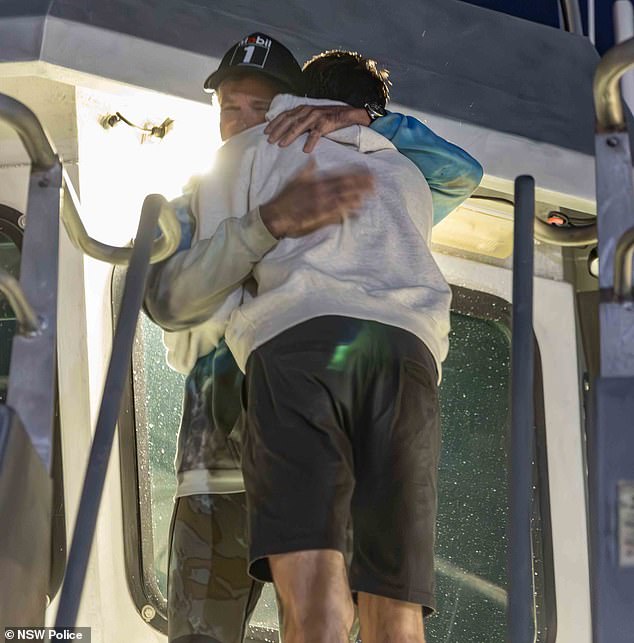 Family welcomed the couple as they arrived at the Nemesis in Balmain at around 6.30pm on Tuesday (Brett is pictured hugging a loved one)