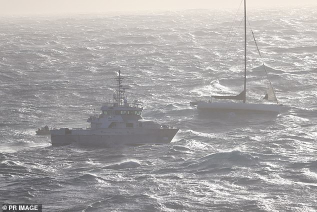 The yacht, Spirit of Mateship, (pictured right) was taking on water and had lost its rudder. The police ship Nemesis (pictured center) arrived around 3 a.m. Tuesday and contacted the crew