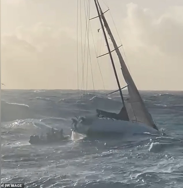 The pair were rescued and were on the Nemesis at 7.25am on Tuesday after the rescue team had to wait due to bad weather (Photos of the moment Brett and Lisa are rescued from their stranded yacht)