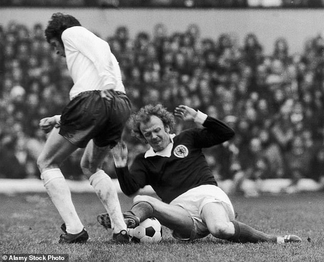 Bremner was a combative figure for both Scotland (above) and Leeds United