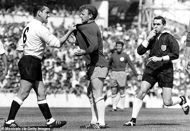 Bremner had his share of battles at Leeds, including this one with Spurs' Dave Mackay