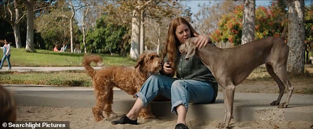 But things take a sinister turn when her son points out her face, her eyes change and she notices that she is growing pointy fangs - just like a dog.