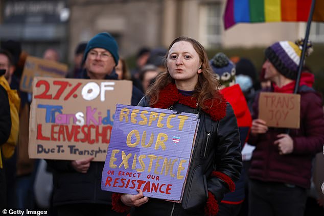 Transgender rights activists protest during a Gender Identity Talk at Portobello Library on March 14, 2023 in Edinburgh