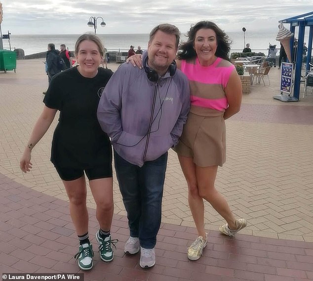 The actor and writer appeared to be in high spirits as he posed for photographs in the Welsh town