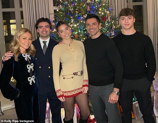 Along with Lola, longtime married couple Kelly and Mark have sons Michael, 27, and Joaquin, 21