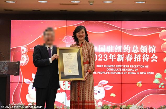 Sun is seen above being honored at a meeting of the Consulate of the People's Republic of China, in an image included in the Justice Department's indictment