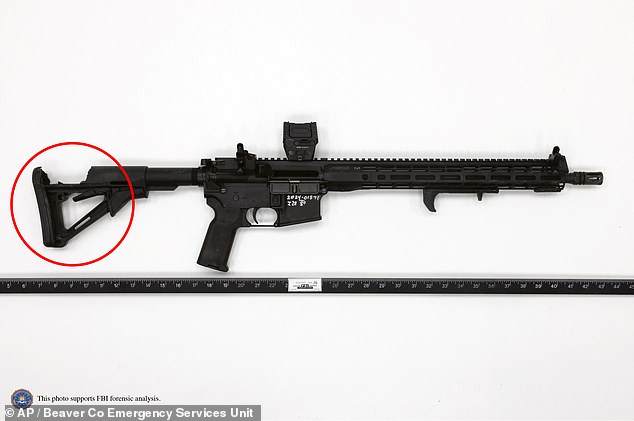 Newly released images of Crooks' AR-style rifle show the butt end of the firearm with a large hole where the bullet struck near the shooter's shoulder