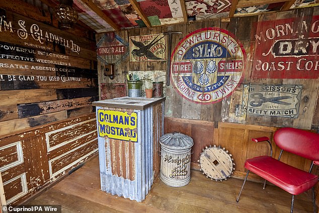 Wayne's shed, where he keeps his garden tools, is also equipped with a vintage red leather chair and a high table