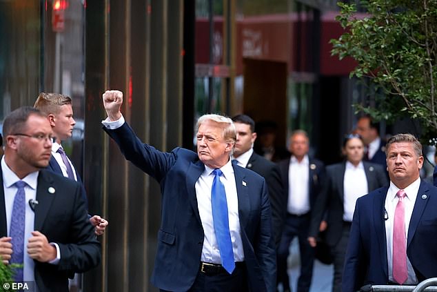 Former US President Donald Trump (center) gestures to the media and crowd outside Trump Tower after a jury found him guilty on all 34 charges in his criminal trial in New York