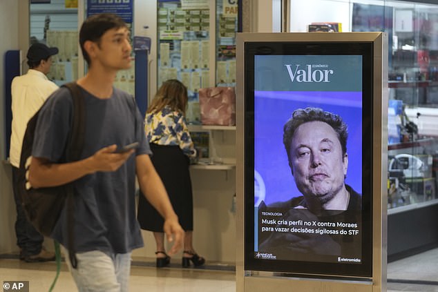 An advertisement from media outlet Valor shows a photo of Elon Musk at a shopping mall in Brasilia, Brazil, Monday, Sept. 2, 2024. The sign reads in Portuguese: "Musk profiles X against Moraes to leak confidential Supreme Court decisions," referring to Supreme Court Judge Alexandre de Moraes who ordered the platform to be blocked for not appointing a local legal representative as required by law