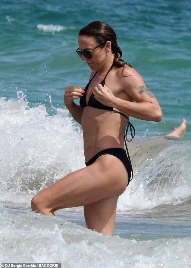 Mel was seen running out of the water as she tried to avoid being splashed by a wave