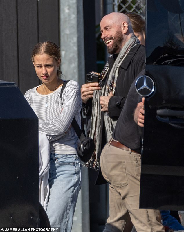 Travolta's daughter Ella looked casually cool in a long-sleeved striped T-shirt and blue jeans