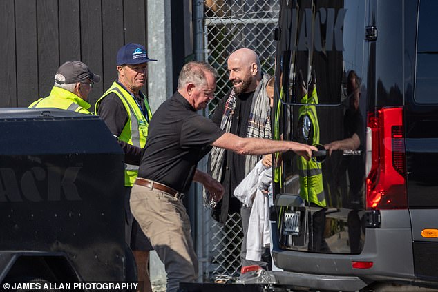 Travolta chatted happily with the ground crew