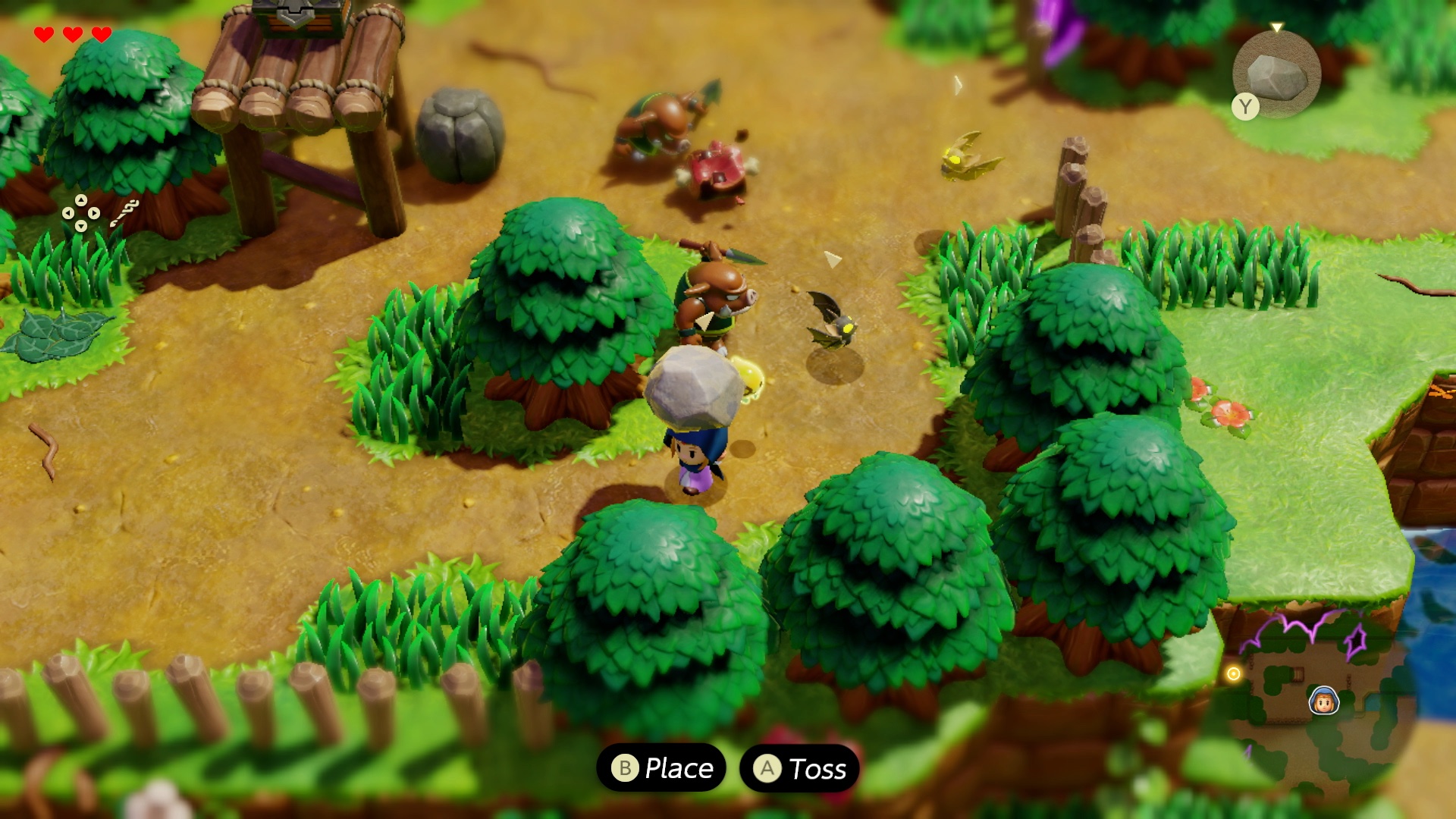 Zelda holds a rock above her head as Moblins battle in a screenshot from The Legend of Zelda: Echoes of Wisdom