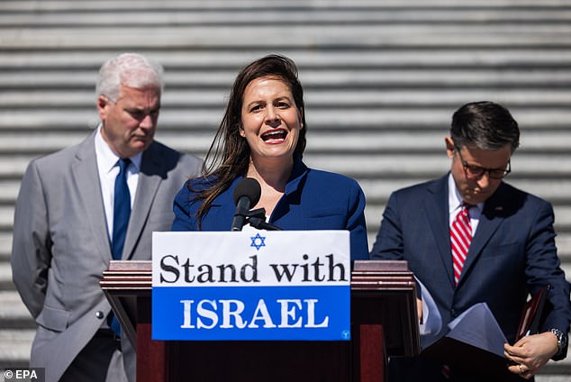 House Republican Conference Chair Elise Stefanik (C) speaks with House Majority Leader Tom Emmer (L) and House Speaker Mike Johnson (R) at a news conference