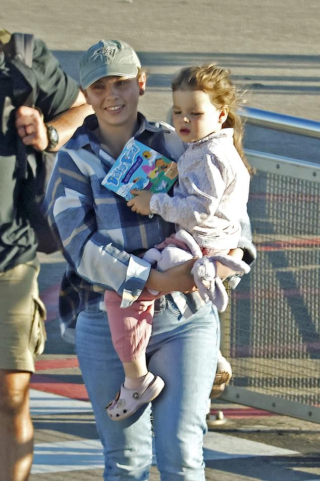 Bindi opted for comfort in a casual checked shirt over a grey tee, paired with light blue jeans and white sneakers