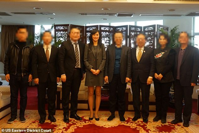 Sun is seen posing with All-China Federation of Returned Overseas Chinese (ACFROC) members in more evidence presented by the US government