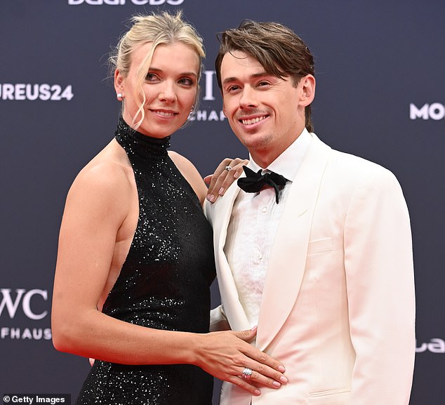 De Minaur (right) is cheered on by his girlfriend Katie Boulter (left), Britain's top female tennis player