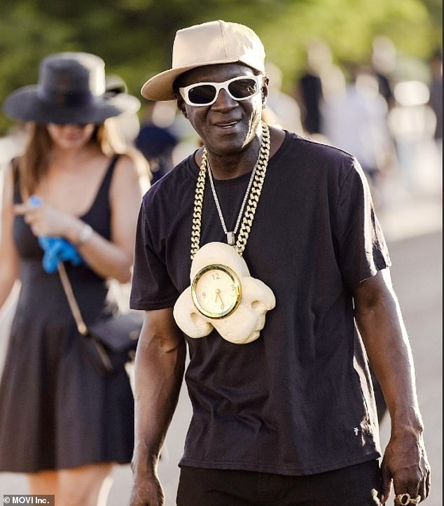 It looked like he was going to the movies. Flav has been wearing a big clock around his neck since the 80s because it's his signature look