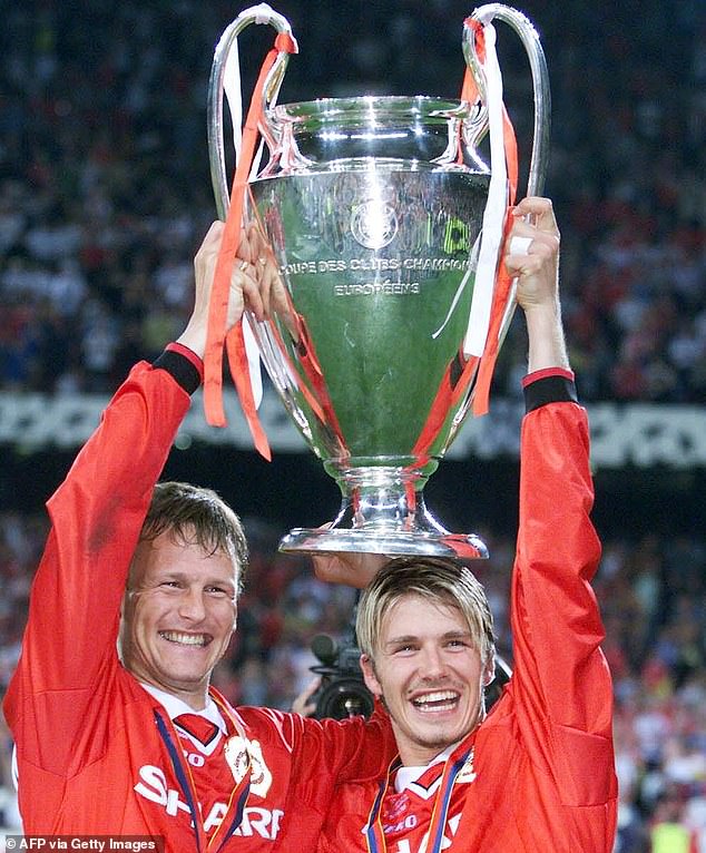 Sheringham, pictured with David Beckham (right), won an iconic treble with United in 1999