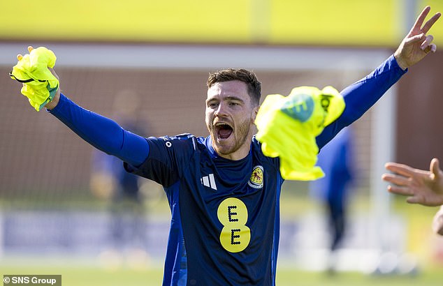 Skipper Andy Robertson keeps spirits high during a Scottish training session