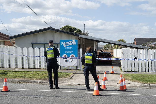 The baby was found in a critical condition in the driveway of a home in Dandenong North in Melbourne's south-east at 2.40am on Friday (police are pictured outside the home)