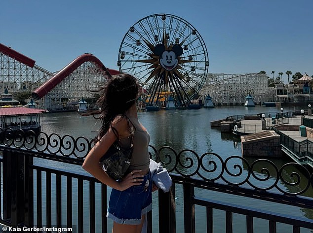 Gerber wore a tight, nude tank top with thin straps and wore white socks with her bright red tennis shoes. She had a bag over her shoulder with a hair clip attached to it