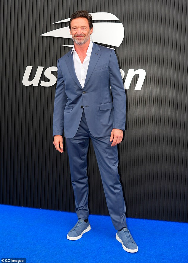 Jackman looked handsome in a navy suit and matching spiked shoes at the US Open in New York City on Saturday