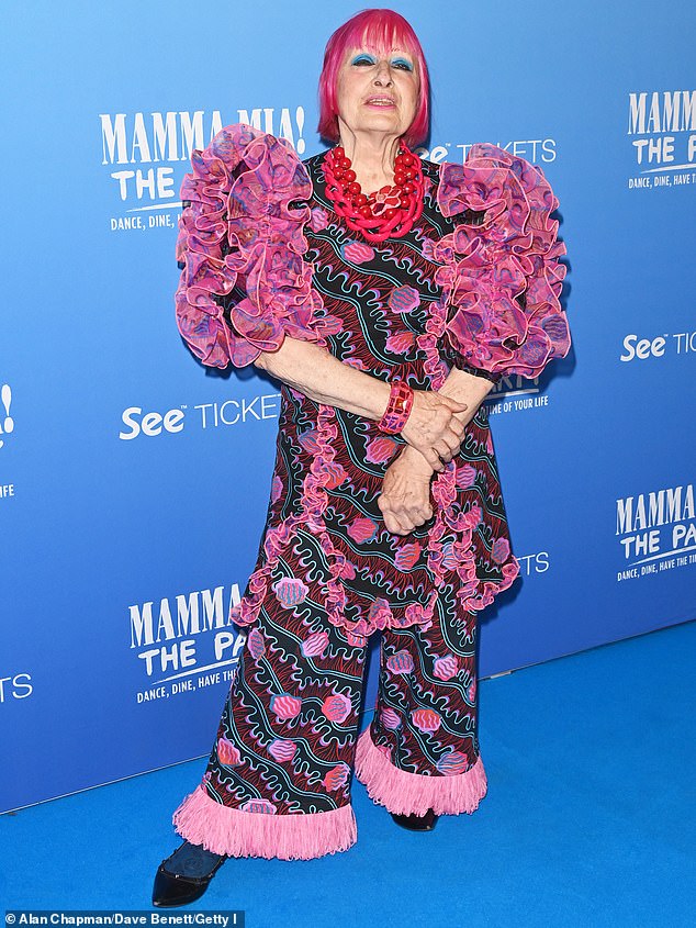 Fashion designer Dame Zandra Rhodes, 83, showed off her quirky style as she stepped out in a dramatic 80s-inspired outfit featuring pleated sleeves and fringed trousers