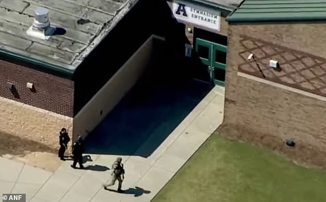 Pictured: Heavily armed police officers were seen entering the school on Wednesday morning