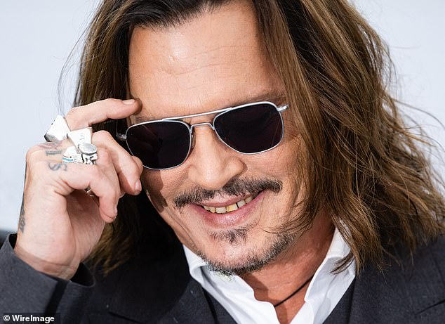 Depp was photographed smiling in May 2023, drawing attention amid a number of oral issues, including teeth that were mismatched in color and appeared to be damaged