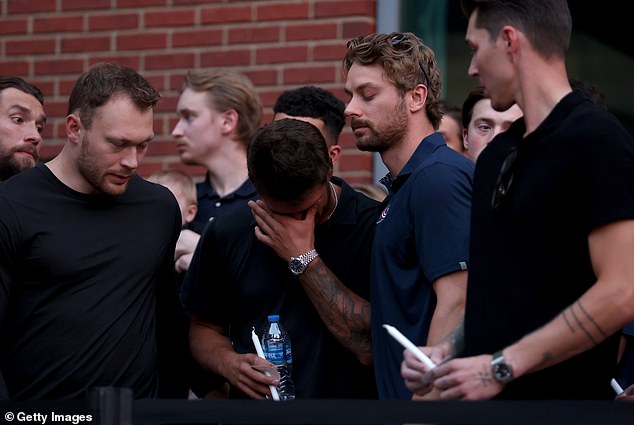 Several of Johnny's Blue Jackets teammates were emotional during the vigi;