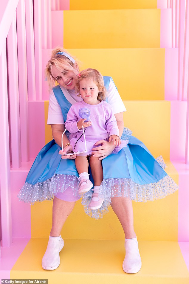 Rebel Wilson and her one-year-old daughter Royce pose for more photos at Polly Pocket's home