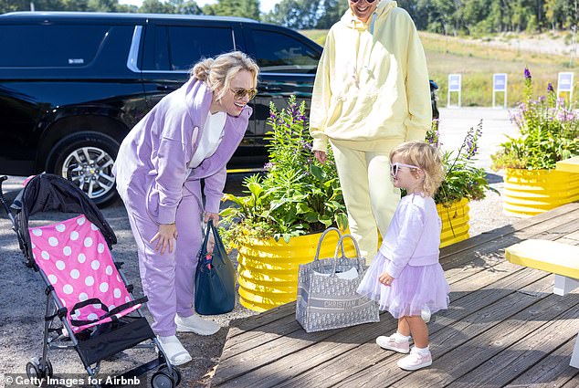 Rebel's daughter Royce wore a matching pastel purple tracksuit paired with a purple tutu and the same heart-shaped sunglasses as her mother for the outing