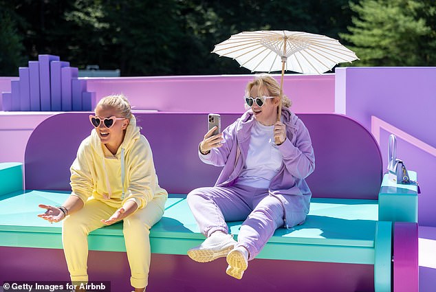 Ramona Agruma and Rebel Wilson arrived for the photoshoot in understated matching tracksuits in purple and yellow hues, accessorized with pink and white heart-shaped sunglasses